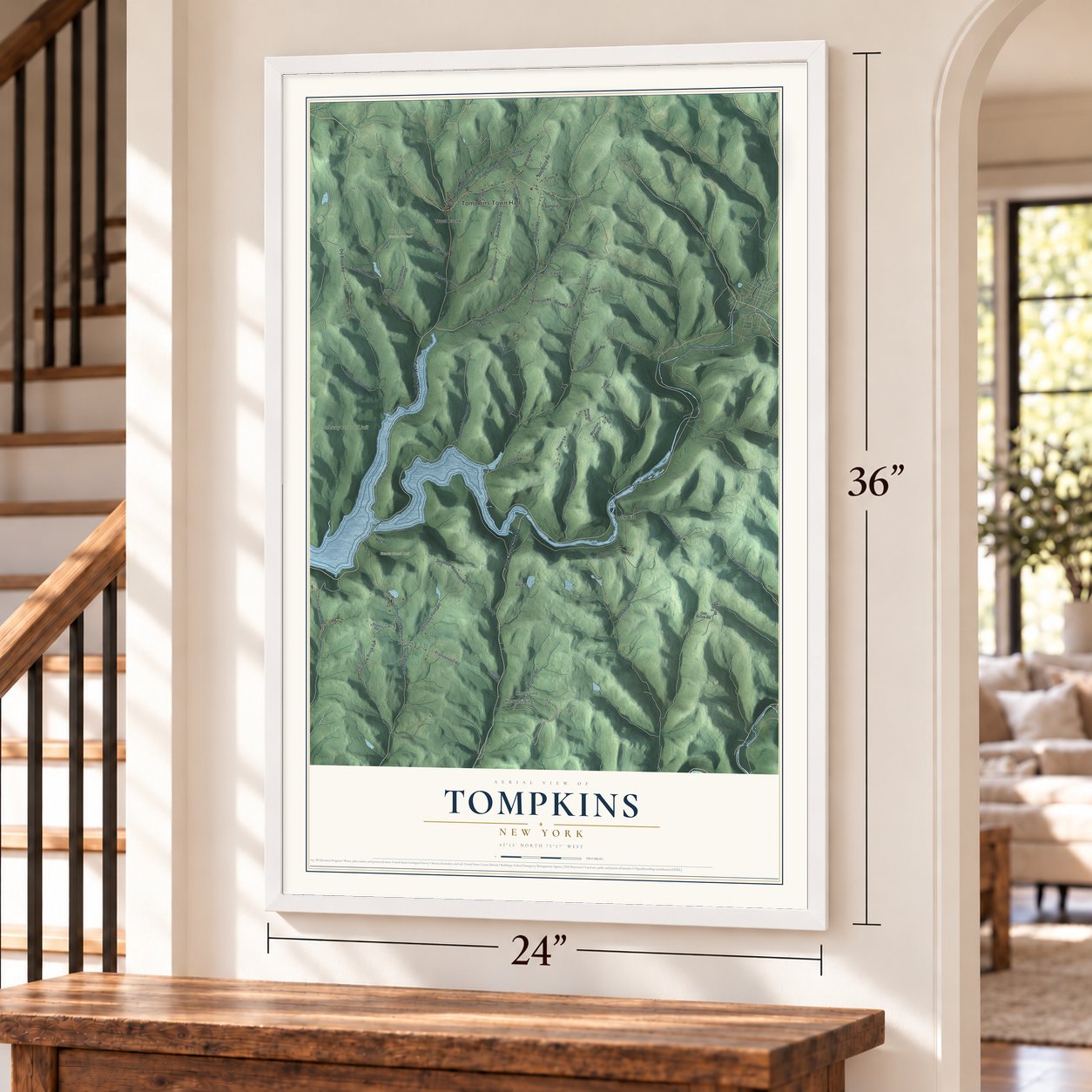 Tompkins, New York map, 24 x 36 inch print in a white frame by a staircase