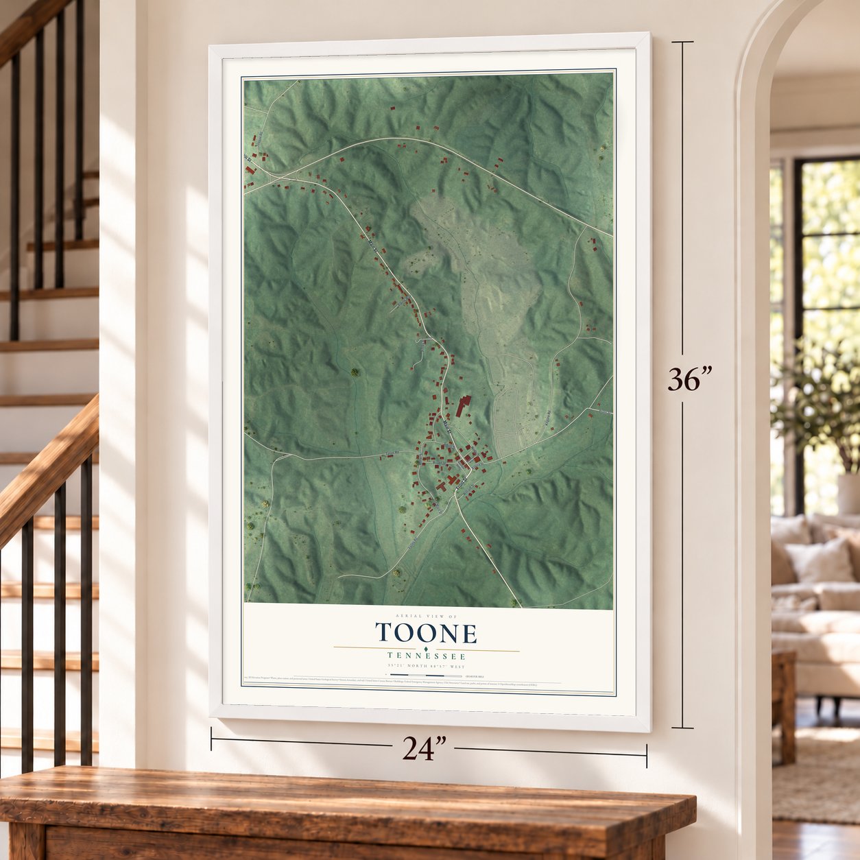 Toone, Tennessee map, 24 x 36 inch print in a white frame by a staircase