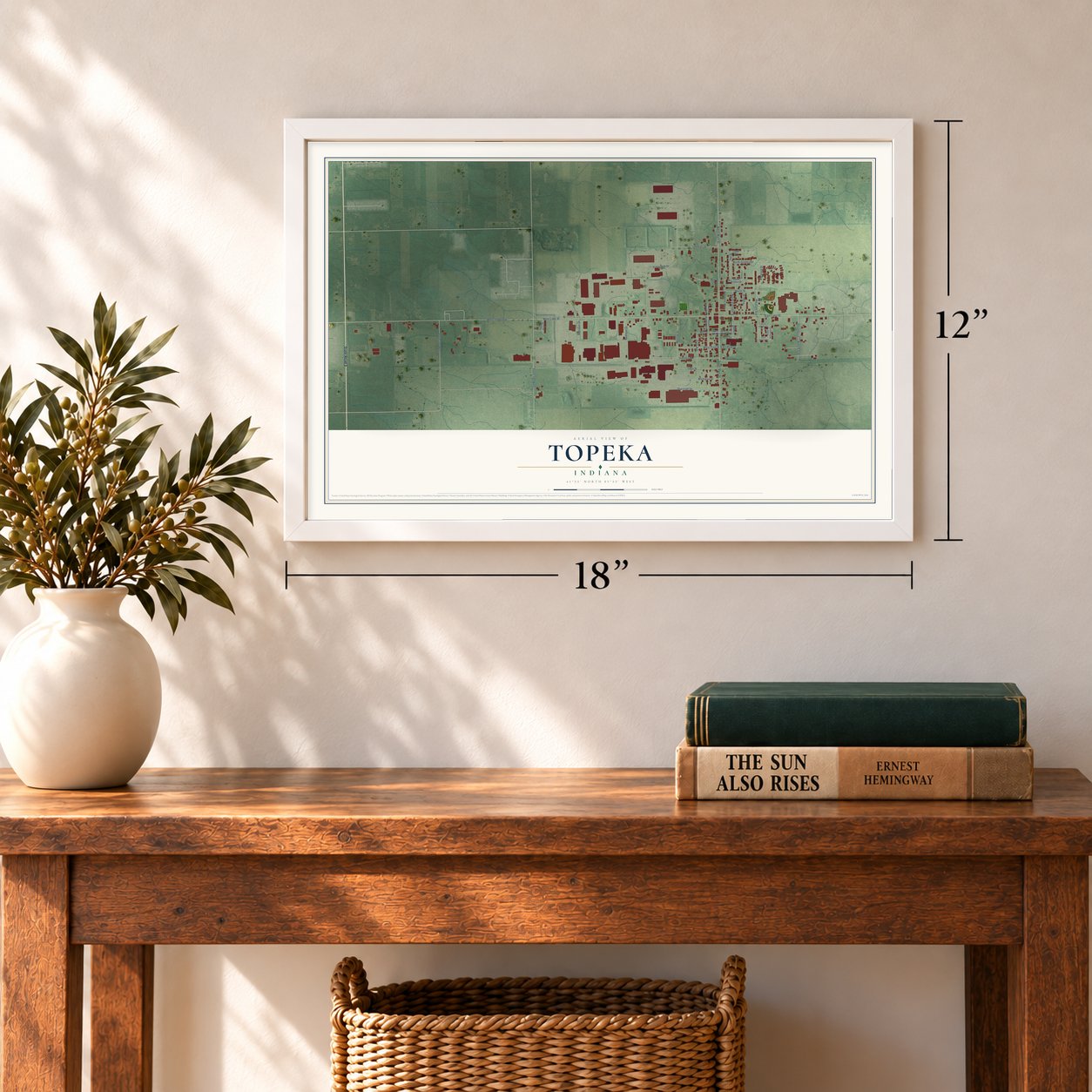 Topeka, Indiana map, 12 x 18 inch print in a white frame in an entryway