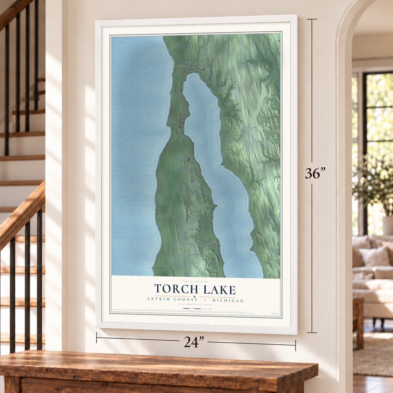 Torch Lake, Antrim County, Michigan map, 24 x 36 inch print in a white frame by a staircase