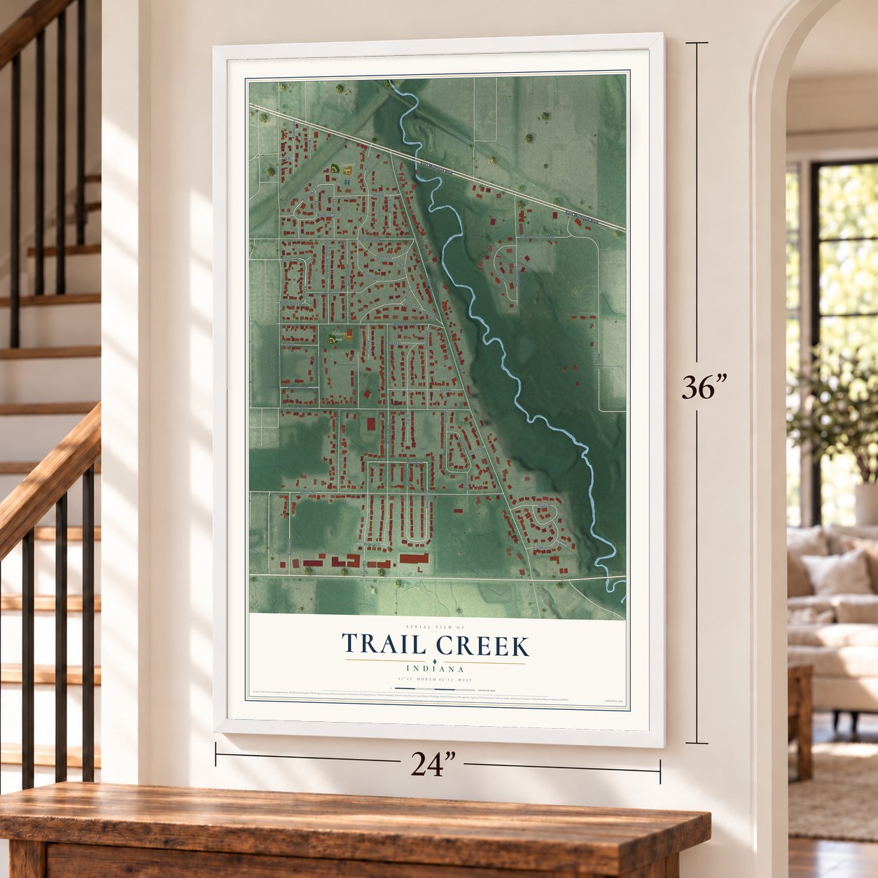 Trail Creek, Indiana map, 24 x 36 inch print in a white frame by a staircase