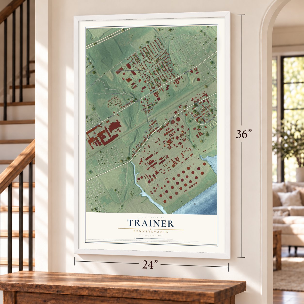 Trainer, Pennsylvania map, 24 x 36 inch print in a white frame by a staircase