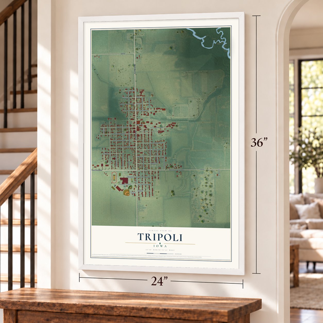 Tripoli, Iowa map, 24 x 36 inch print in a white frame by a staircase