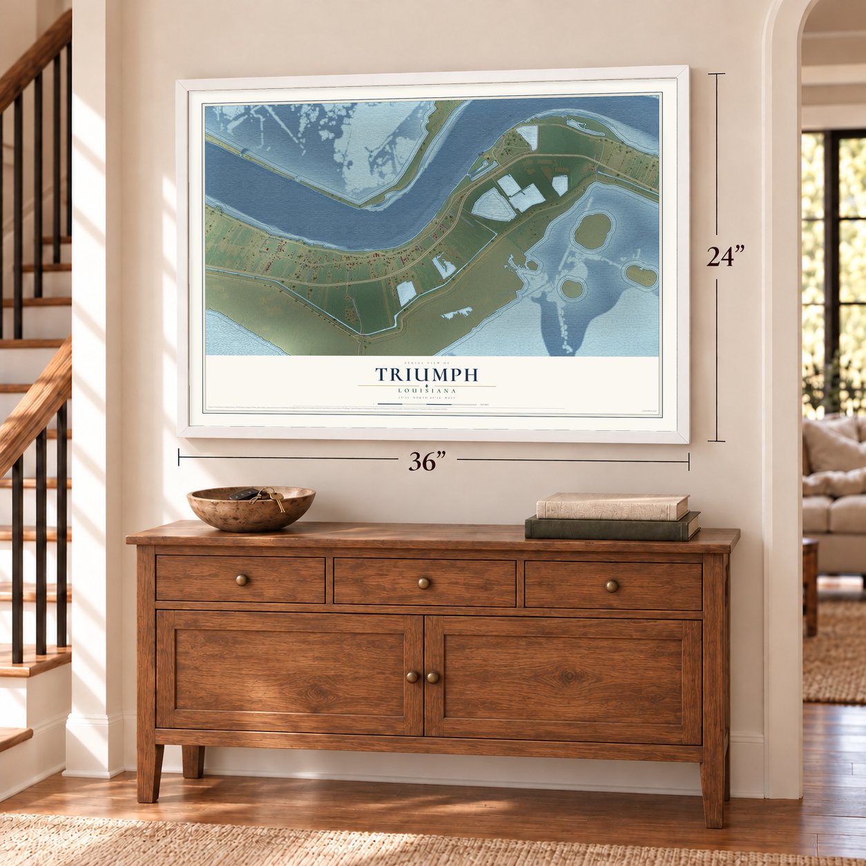 Triumph, Louisiana map, 24 x 36 inch print in a white frame above a dresser by a staircase