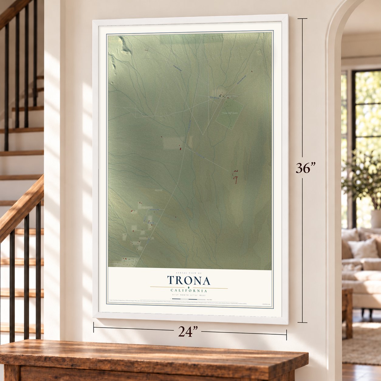 Trona, California map, 24 x 36 inch print in a white frame by a staircase
