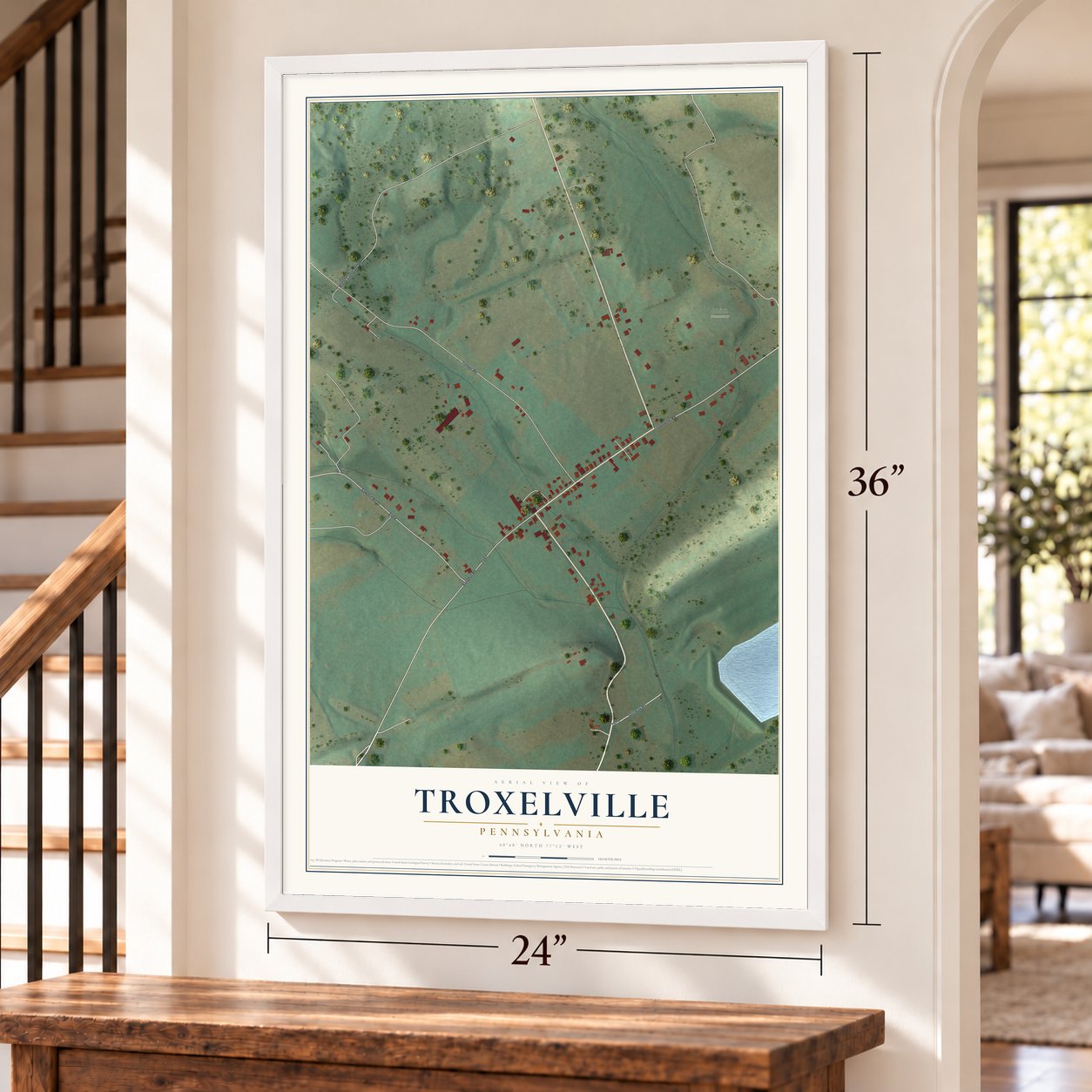 Troxelville, Pennsylvania map, 24 x 36 inch print in a white frame by a staircase