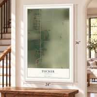 Tucker, Arkansas map, 24 x 36 inch print in a white frame by a staircase