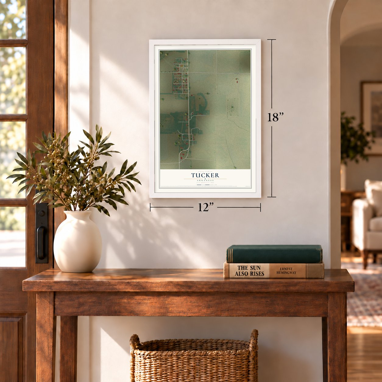 Tucker, Arkansas map, 12 x 18 inch print in a white frame in an entryway