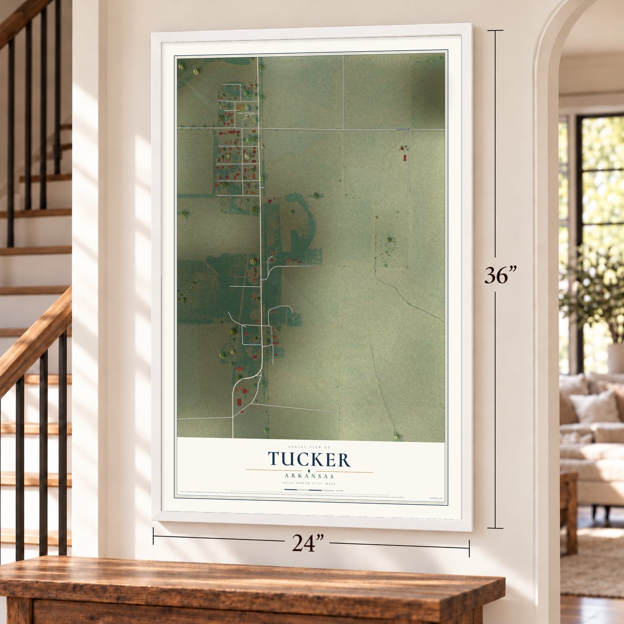 Tucker, Arkansas map, 24 x 36 inch print in a white frame by a staircase