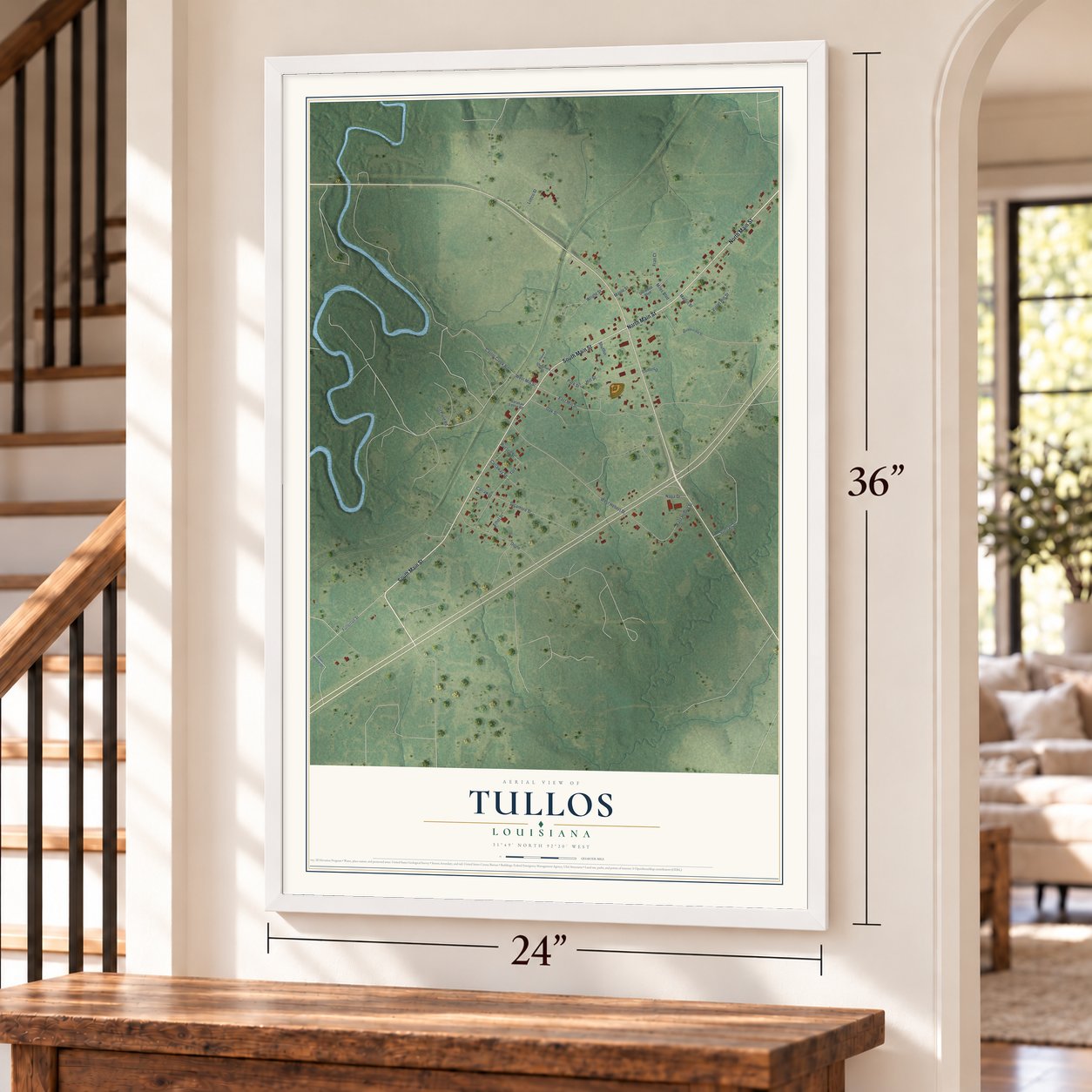 Tullos, Louisiana map, 24 x 36 inch print in a white frame by a staircase