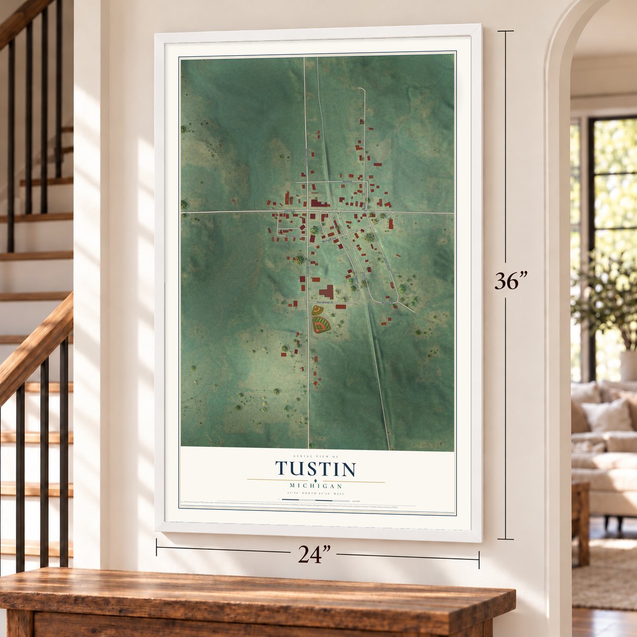 Tustin, Michigan map, 24 x 36 inch print in a white frame by a staircase