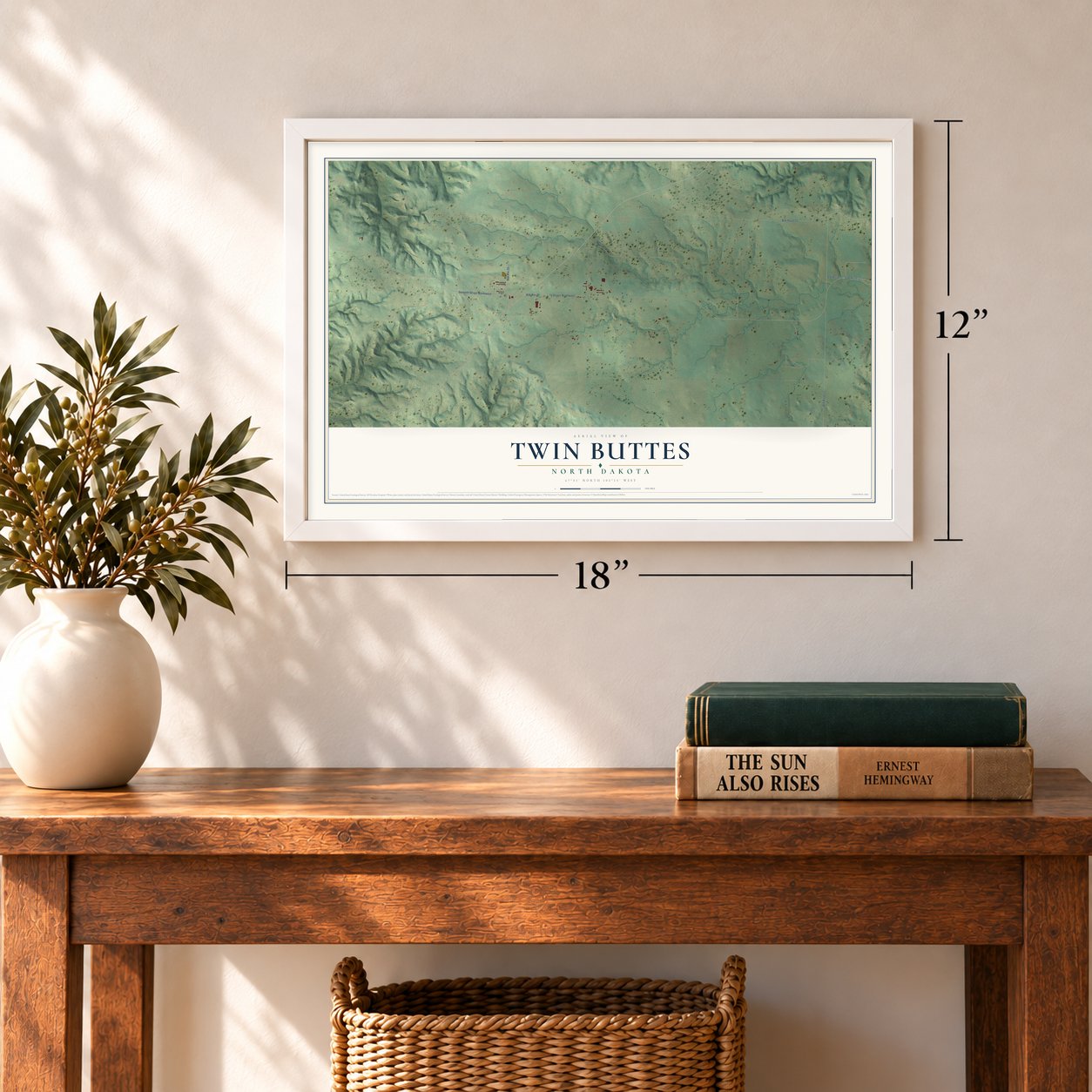 Twin Buttes, North Dakota map, 12 x 18 inch print in a white frame in an entryway
