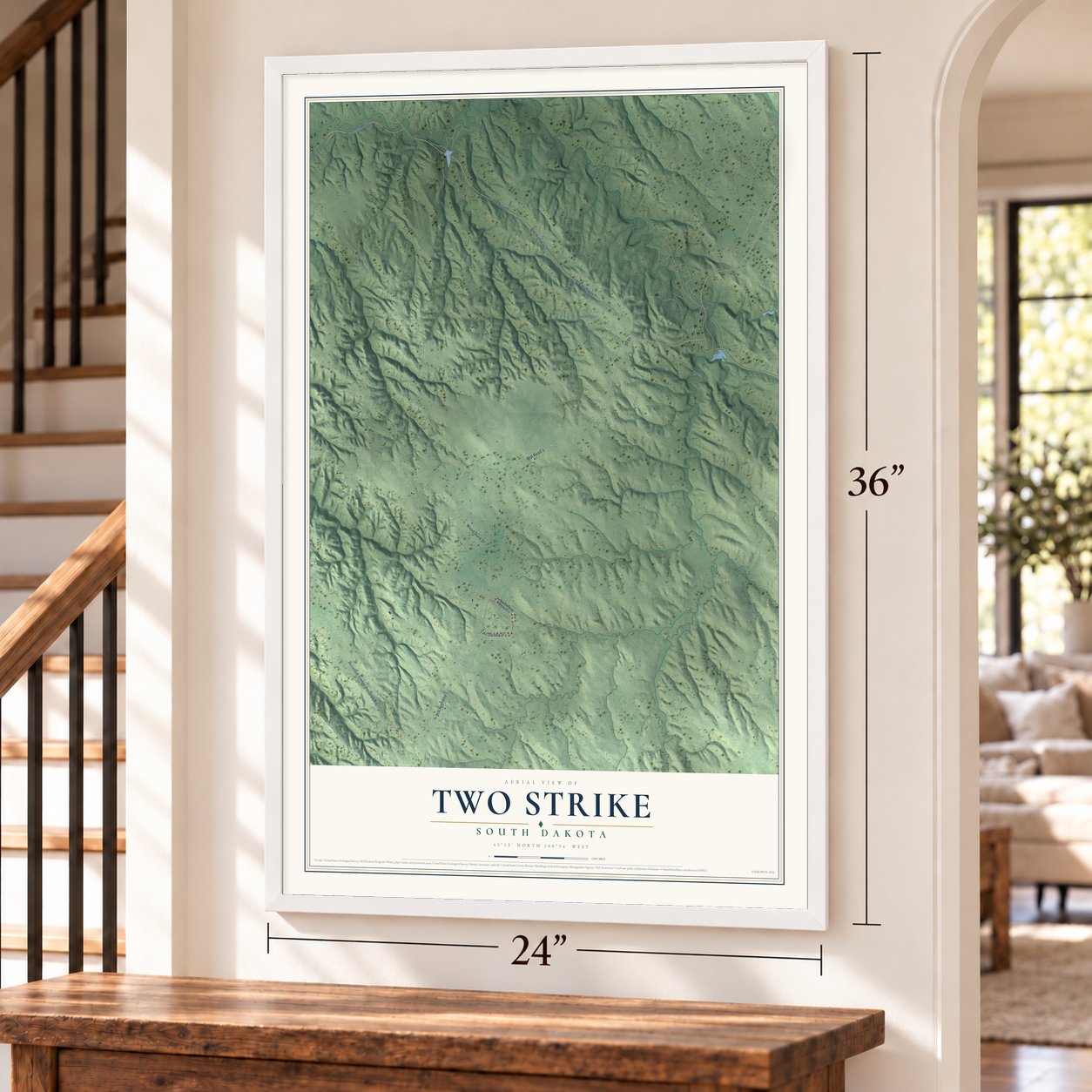 Two Strike, South Dakota map, 24 x 36 inch print in a white frame by a staircase