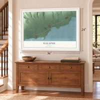 Ualapue, Hawaii map, 24 x 36 inch print in a white frame above a dresser by a staircase
