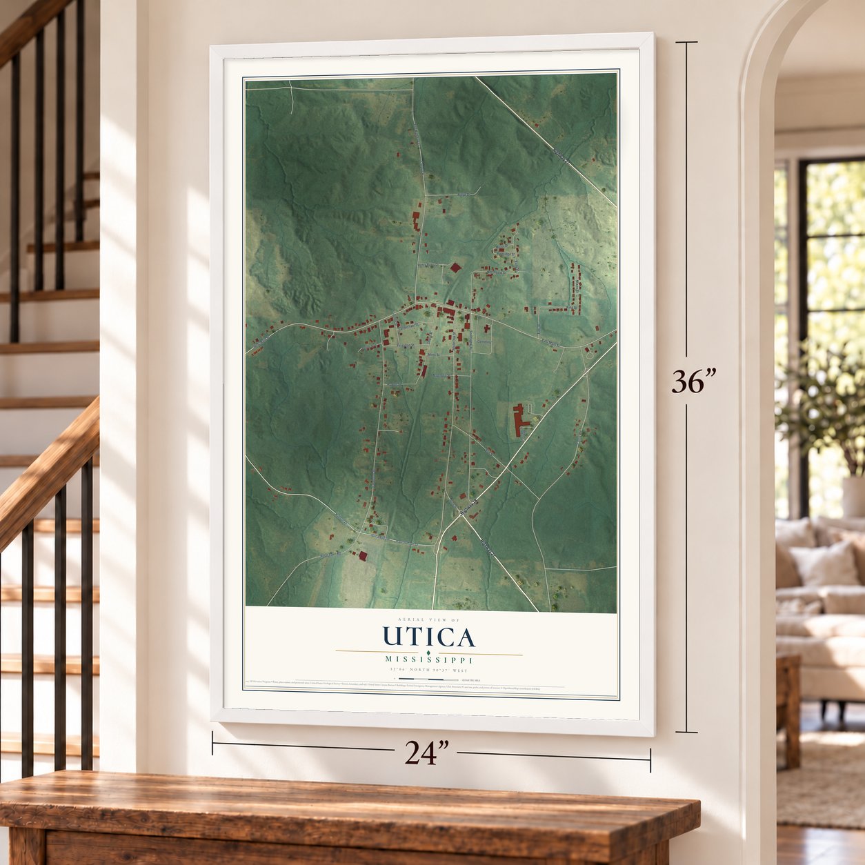 Utica, Mississippi map, 24 x 36 inch print in a white frame by a staircase