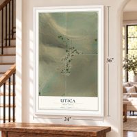 Utica, Montana map, 24 x 36 inch print in a white frame by a staircase