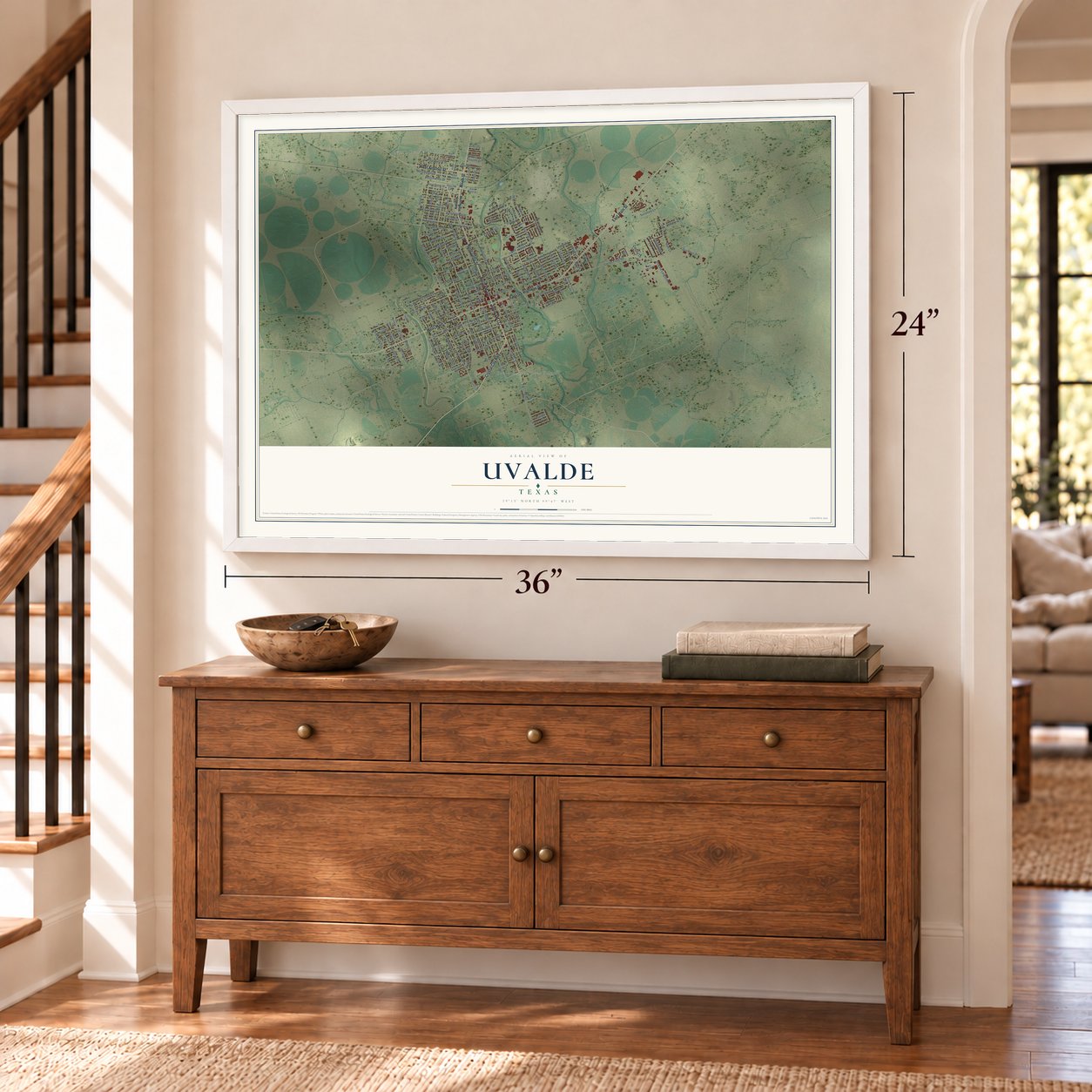 Uvalde, Texas map, 24 x 36 inch print in a white frame above a dresser by a staircase