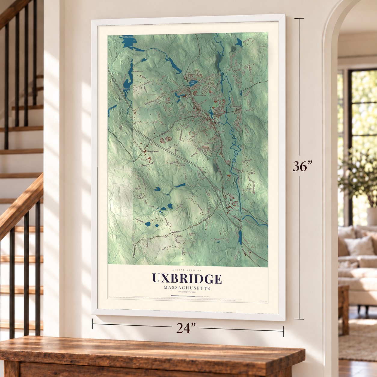 Uxbridge, Massachusetts map, 24 x 36 inch print in a white frame by a staircase