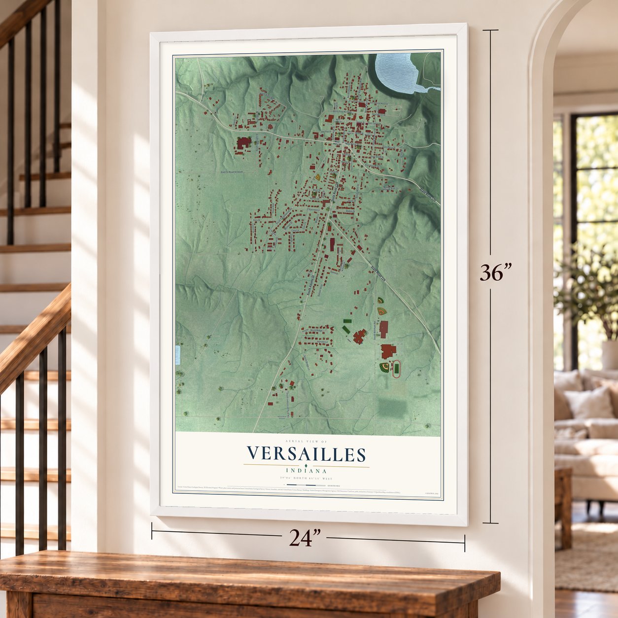 Versailles, Indiana map, 24 x 36 inch print in a white frame by a staircase