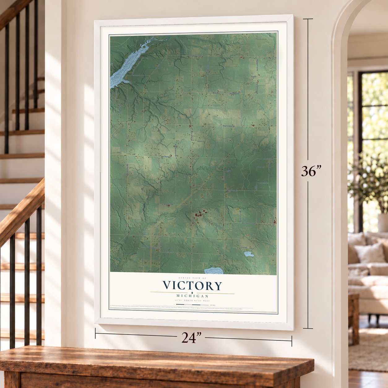 Victory, Michigan map, 24 x 36 inch print in a white frame by a staircase