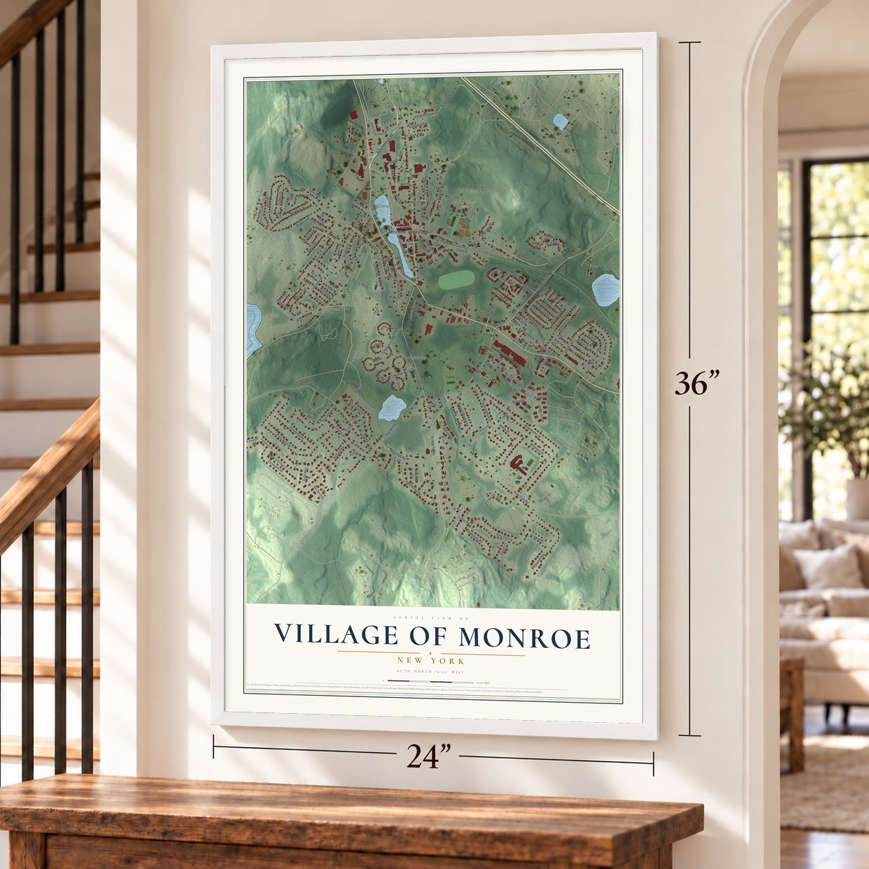 Village of Monroe, New York map, 24 x 36 inch print in a white frame by a staircase