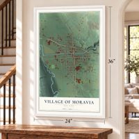 Village of Moravia, New York map, 24 x 36 inch print in a white frame by a staircase
