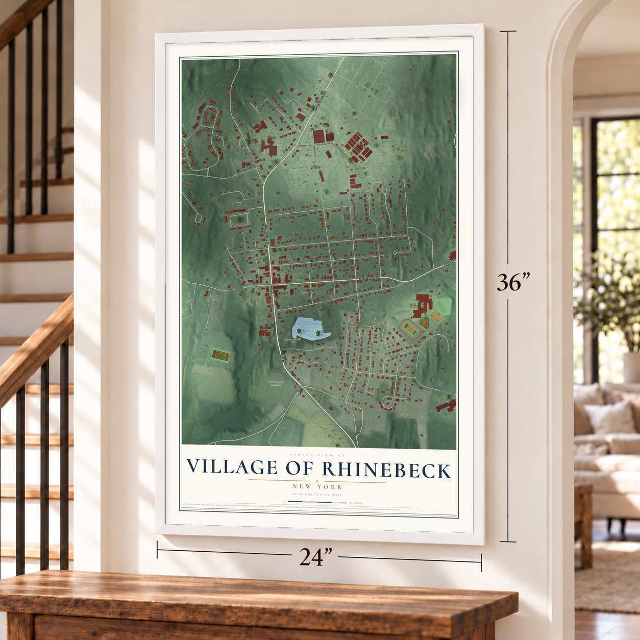 Village of Rhinebeck, New York map, 24 x 36 inch print in a white frame by a staircase