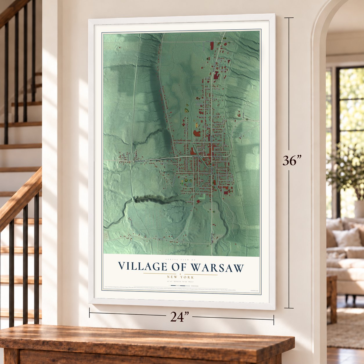 Village of Warsaw, New York map, 24 x 36 inch print in a white frame by a staircase
