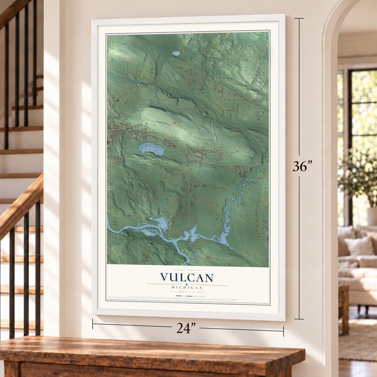 Vulcan, Michigan map, 24 x 36 inch print in a white frame by a staircase