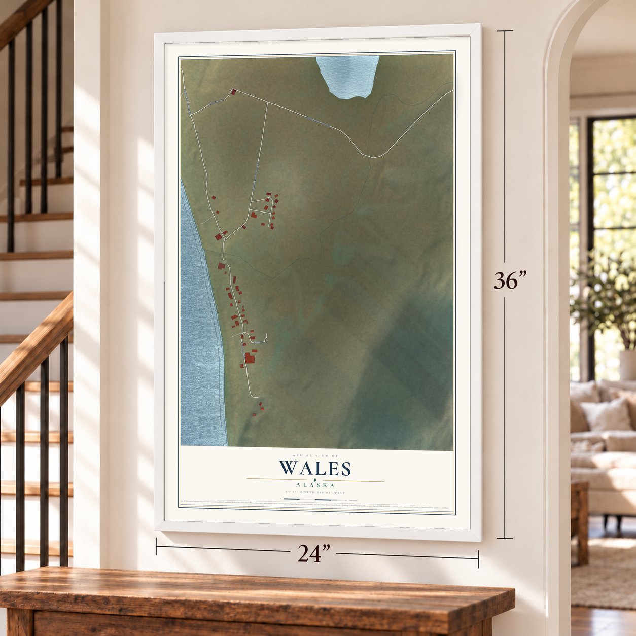 Wales, Alaska map, 24 x 36 inch print in a white frame by a staircase