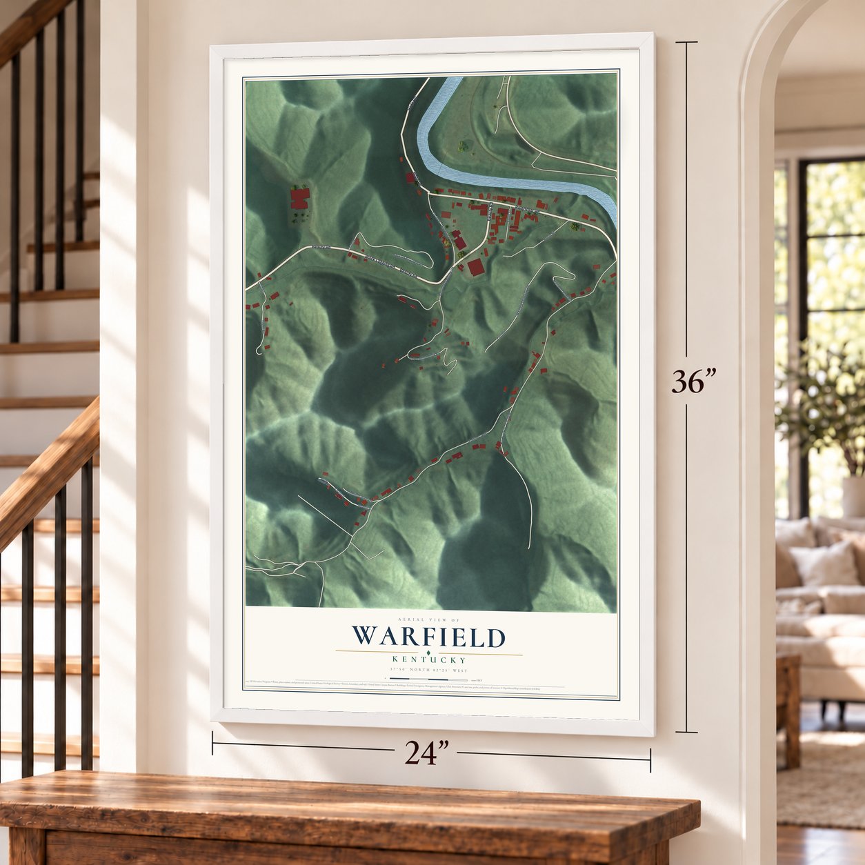Warfield, Kentucky map, 24 x 36 inch print in a white frame by a staircase