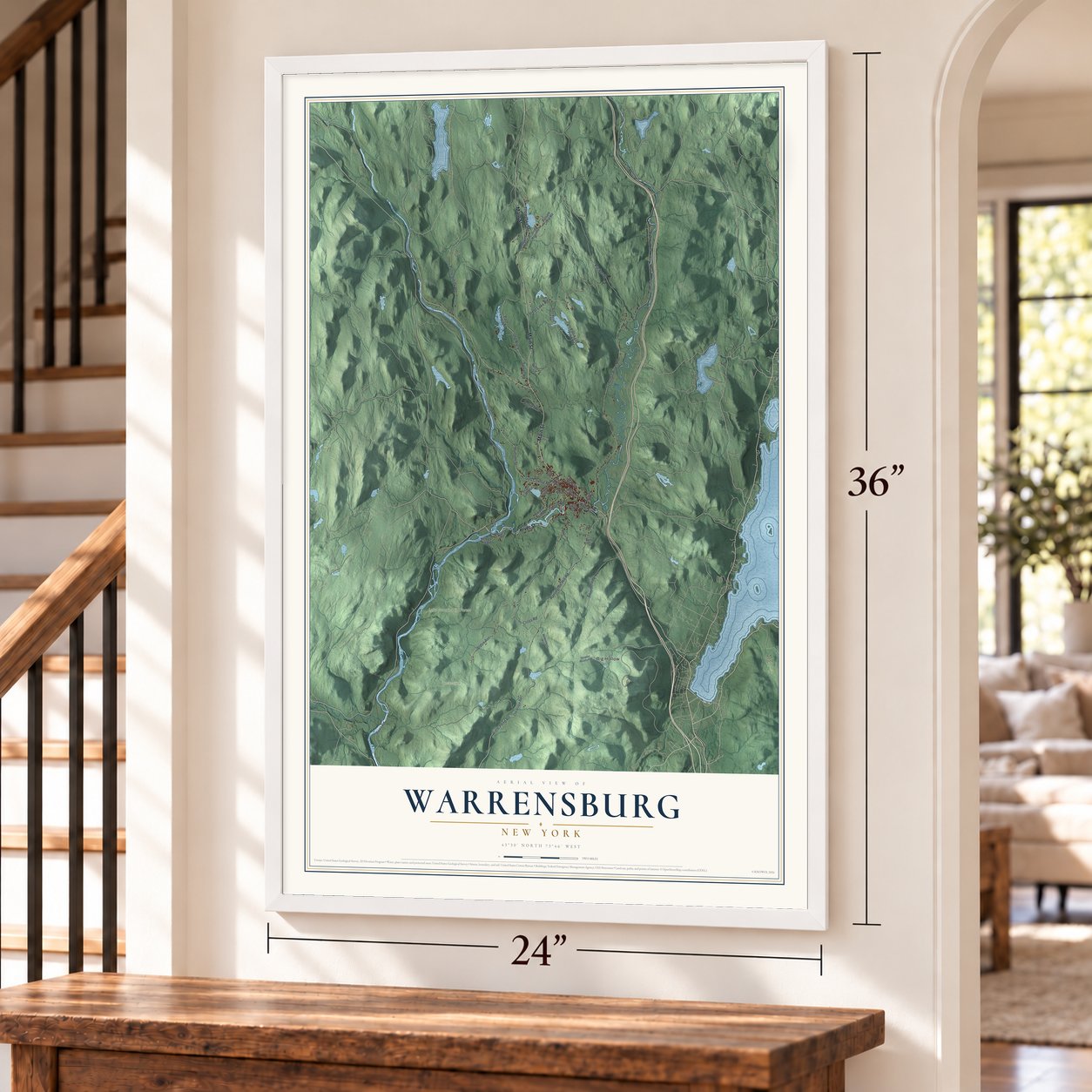 Warrensburg, New York map, 24 x 36 inch print in a white frame by a staircase