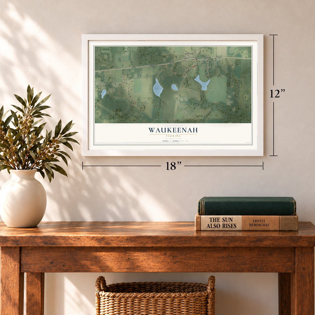 Waukeenah, Florida map, 12 x 18 inch print in a white frame in an entryway