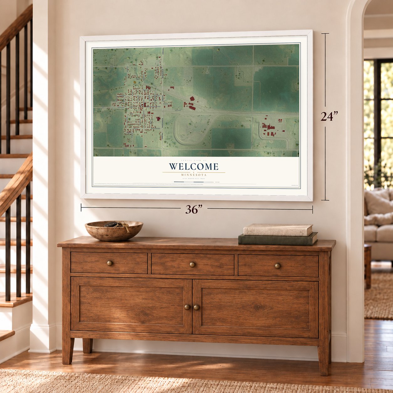 Welcome, Minnesota map, 24 x 36 inch print in a white frame above a dresser by a staircase