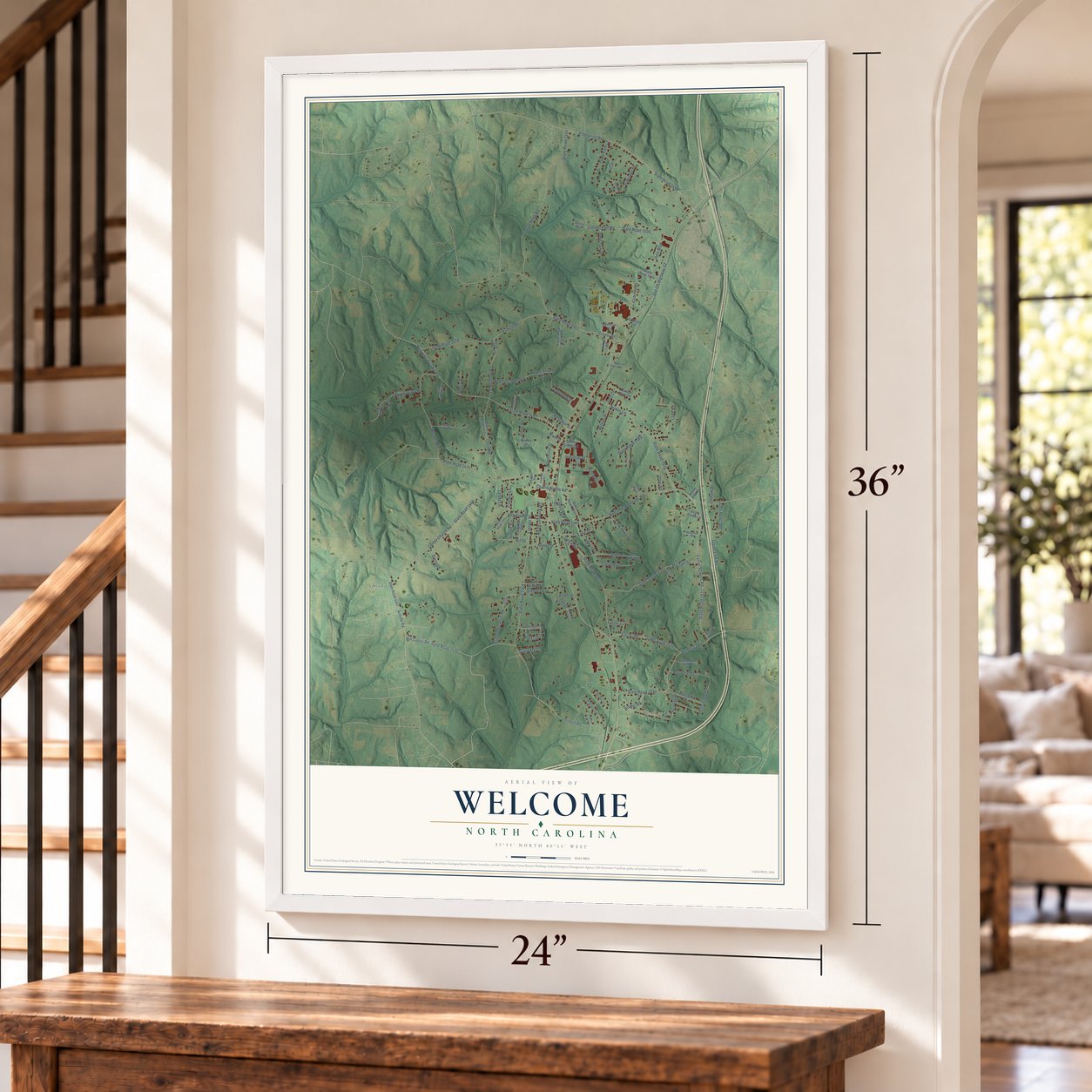 Welcome, North Carolina map, 24 x 36 inch print in a white frame by a staircase