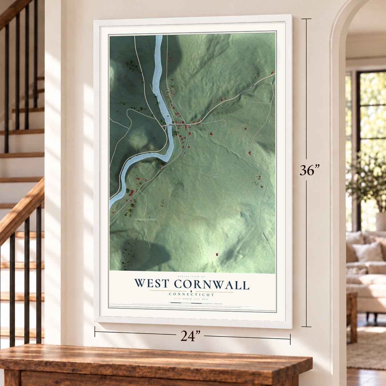 West Cornwall, Connecticut map, 24 x 36 inch print in a white frame by a staircase
