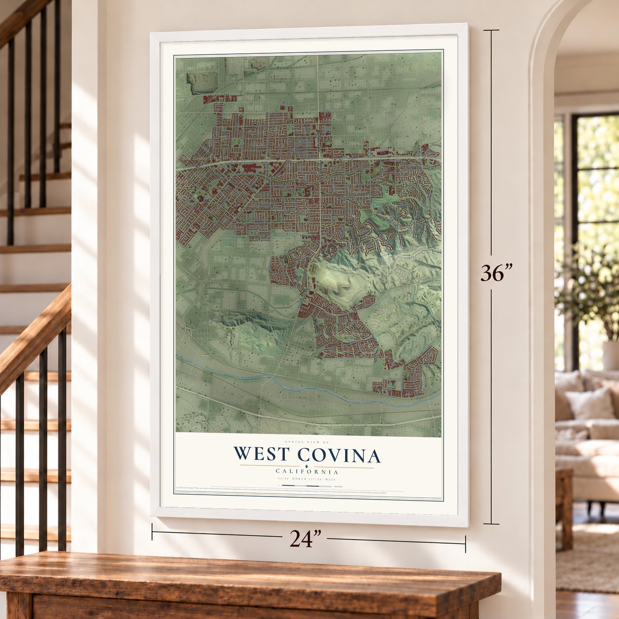 West Covina, California map, 24 x 36 inch print in a white frame by a staircase