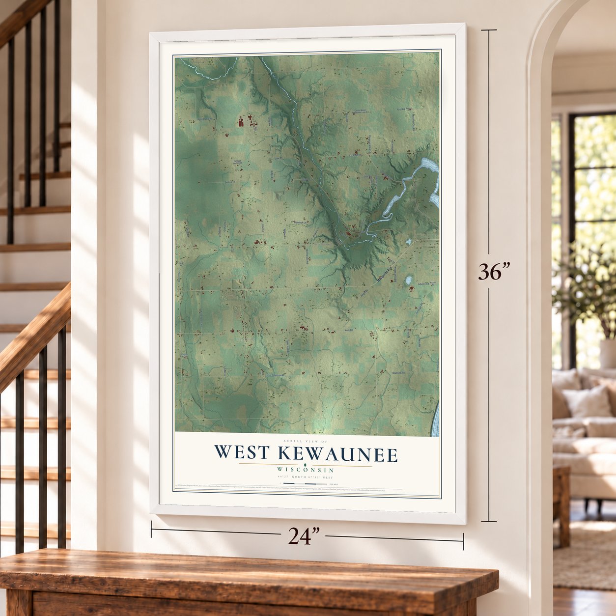 West Kewaunee, Wisconsin map, 24 x 36 inch print in a white frame by a staircase