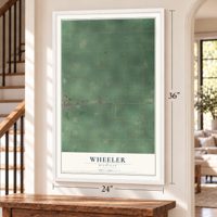 Wheeler, Michigan map, 24 x 36 inch print in a white frame by a staircase
