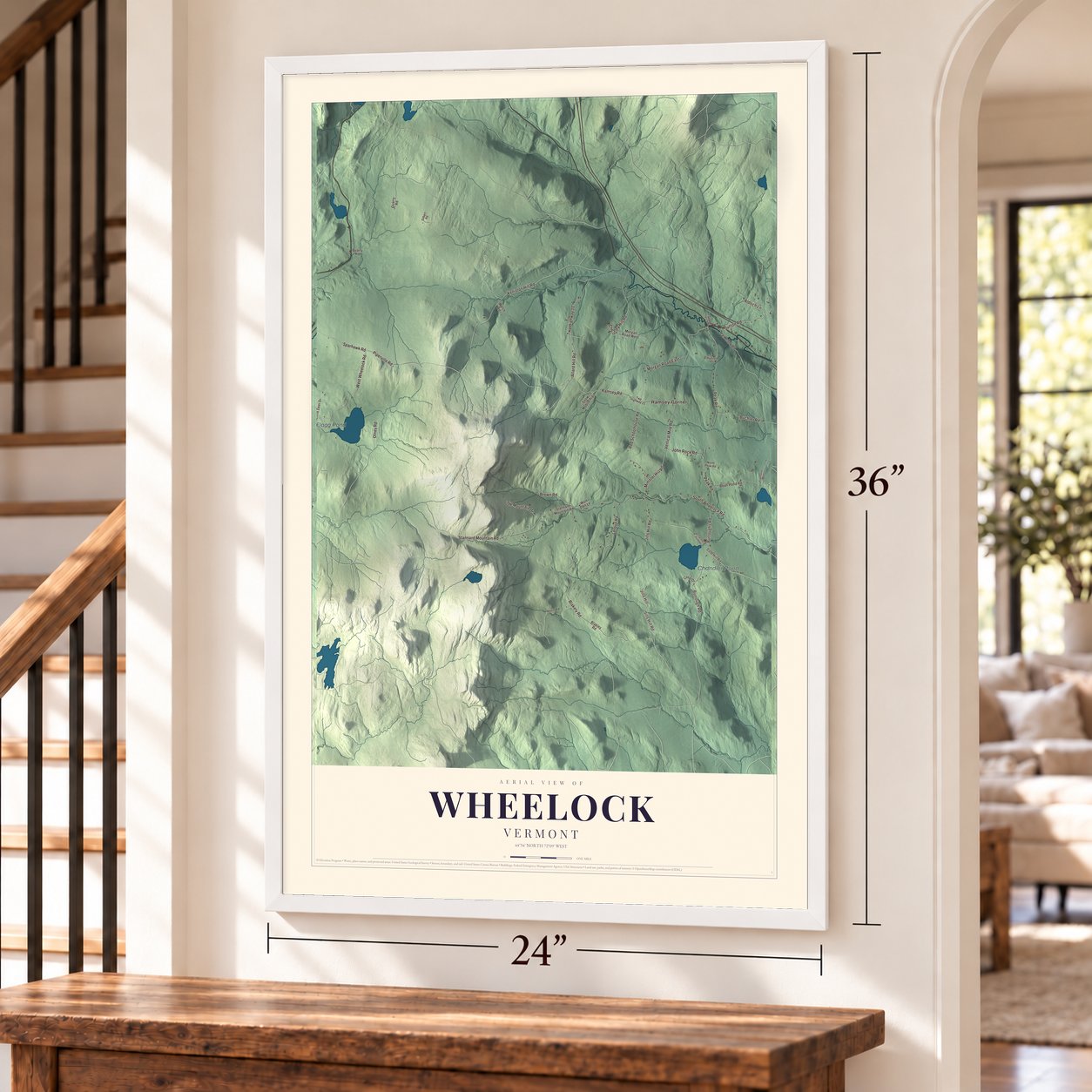 Wheelock, Vermont map, 24 x 36 inch print in a white frame by a staircase