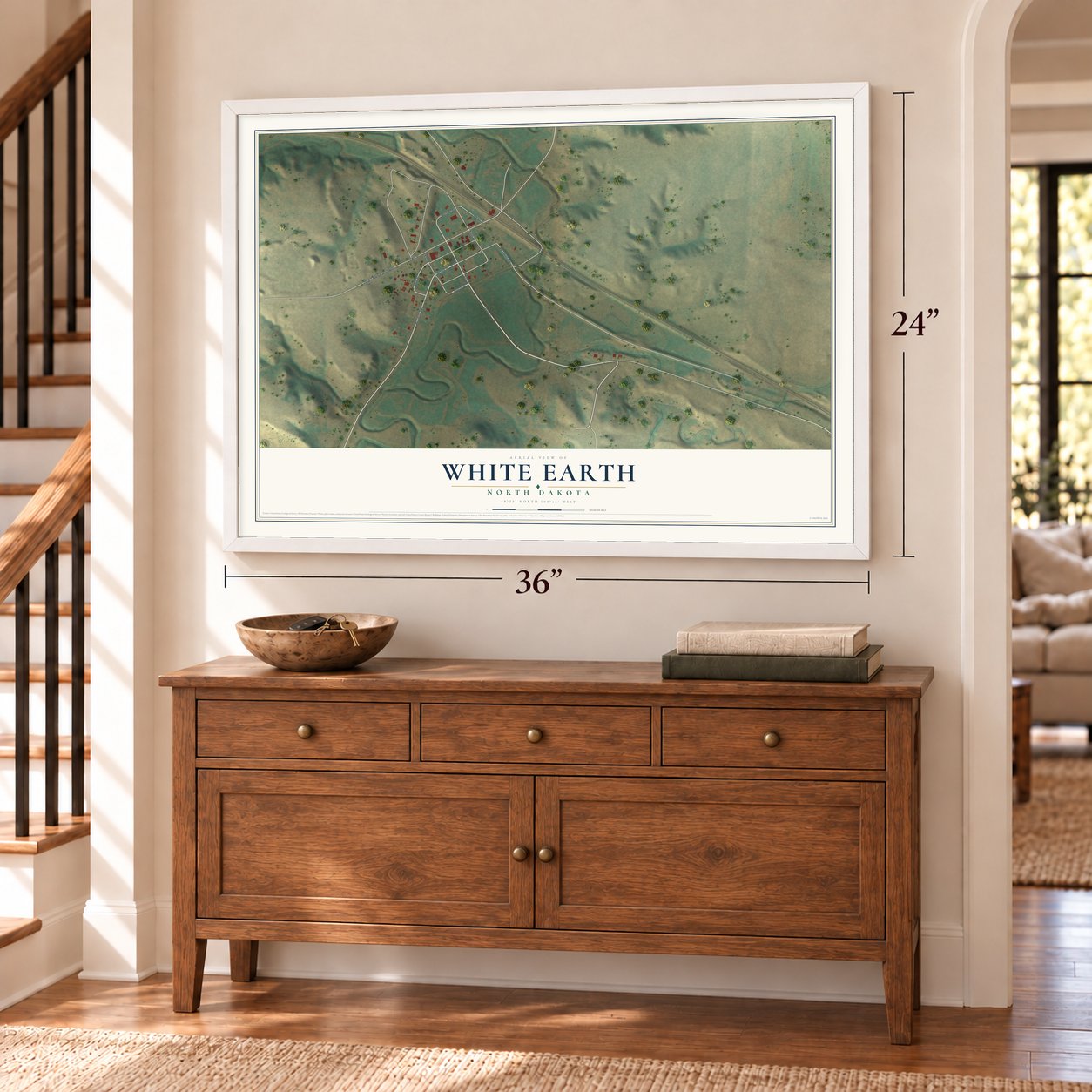 White Earth, North Dakota map, 24 x 36 inch print in a white frame above a dresser by a staircase