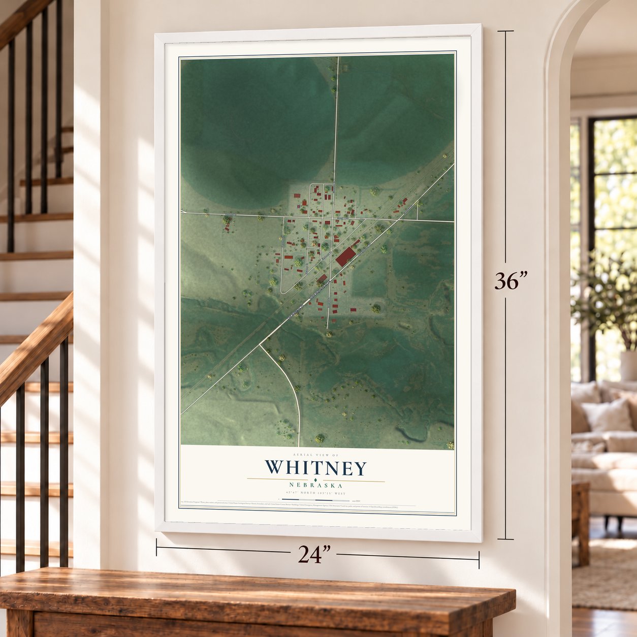 Whitney, Nebraska map, 24 x 36 inch print in a white frame by a staircase