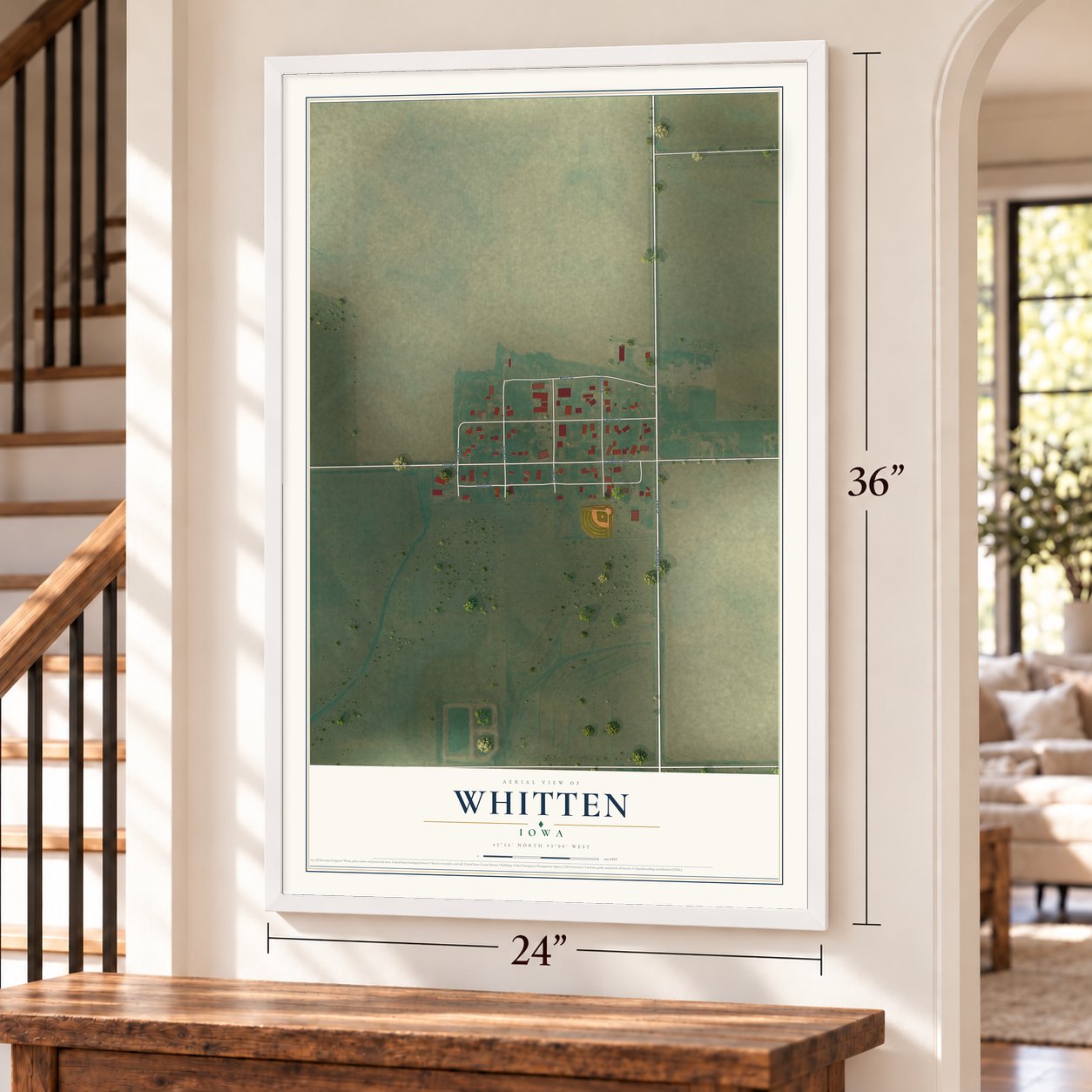 Whitten, Iowa map, 24 x 36 inch print in a white frame by a staircase