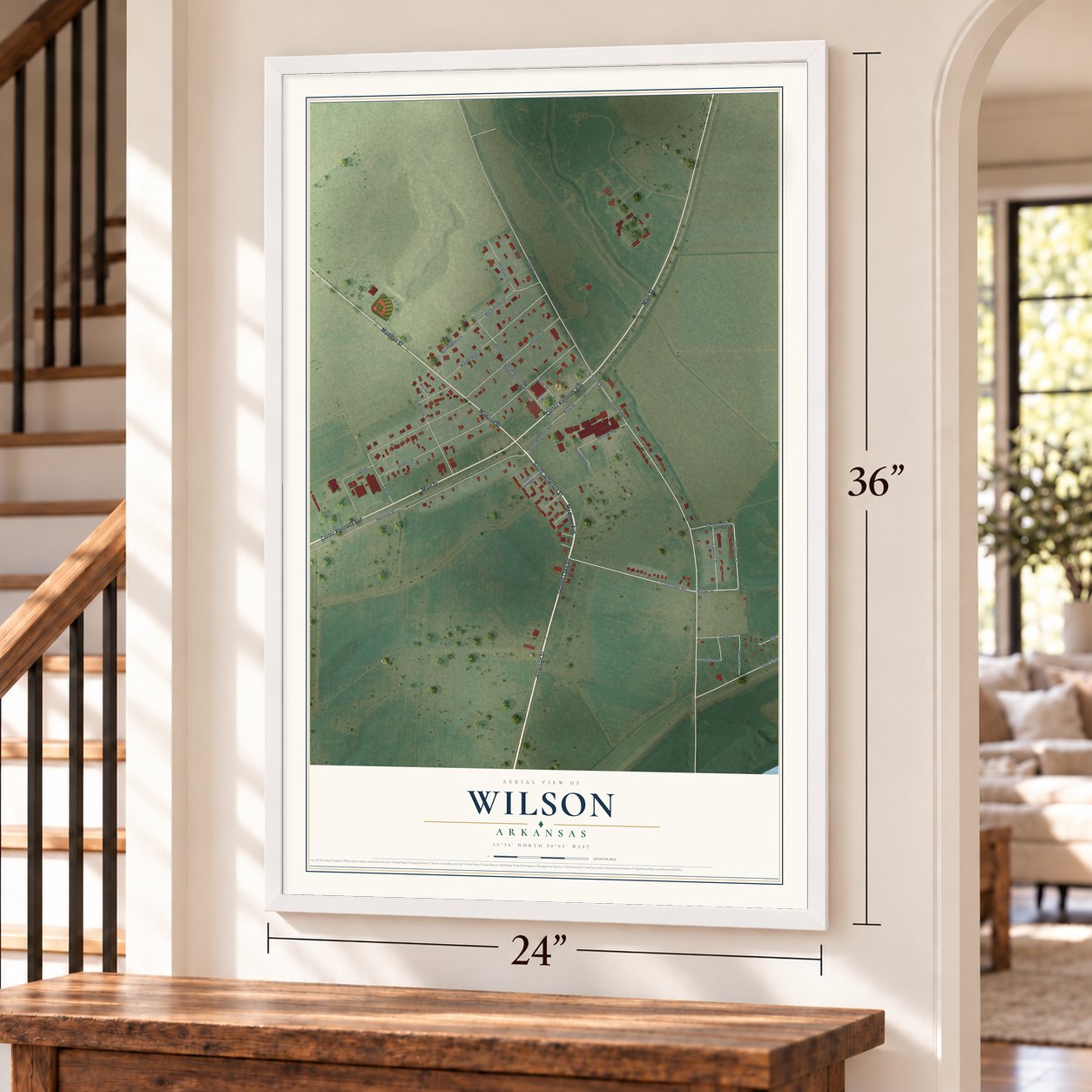 Wilson, Arkansas map, 24 x 36 inch print in a white frame by a staircase