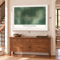 Wilton Center, Illinois map, 24 x 36 inch print in a white frame above a dresser by a staircase