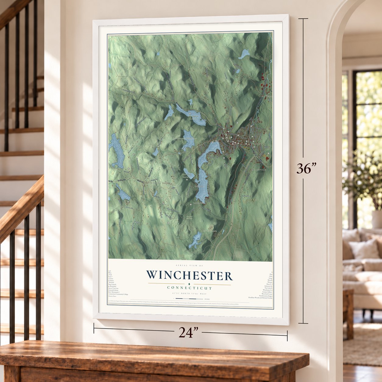 Winchester, Connecticut map, 24 x 36 inch print in a white frame by a staircase