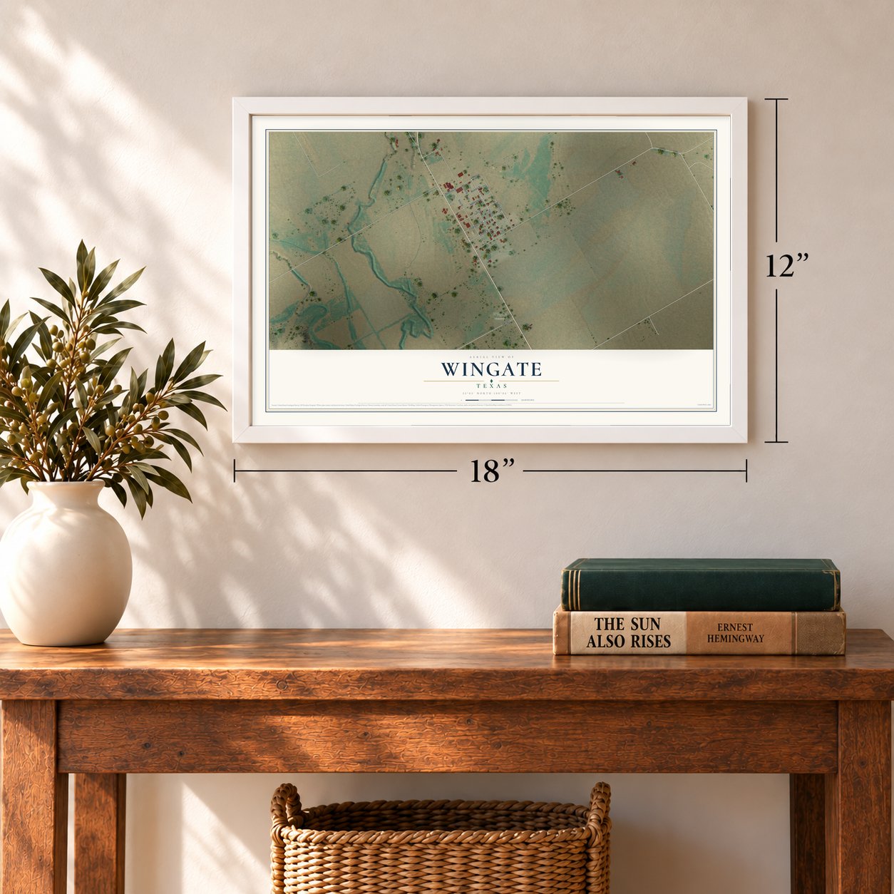 Wingate, Texas map, 12 x 18 inch print in a white frame in an entryway