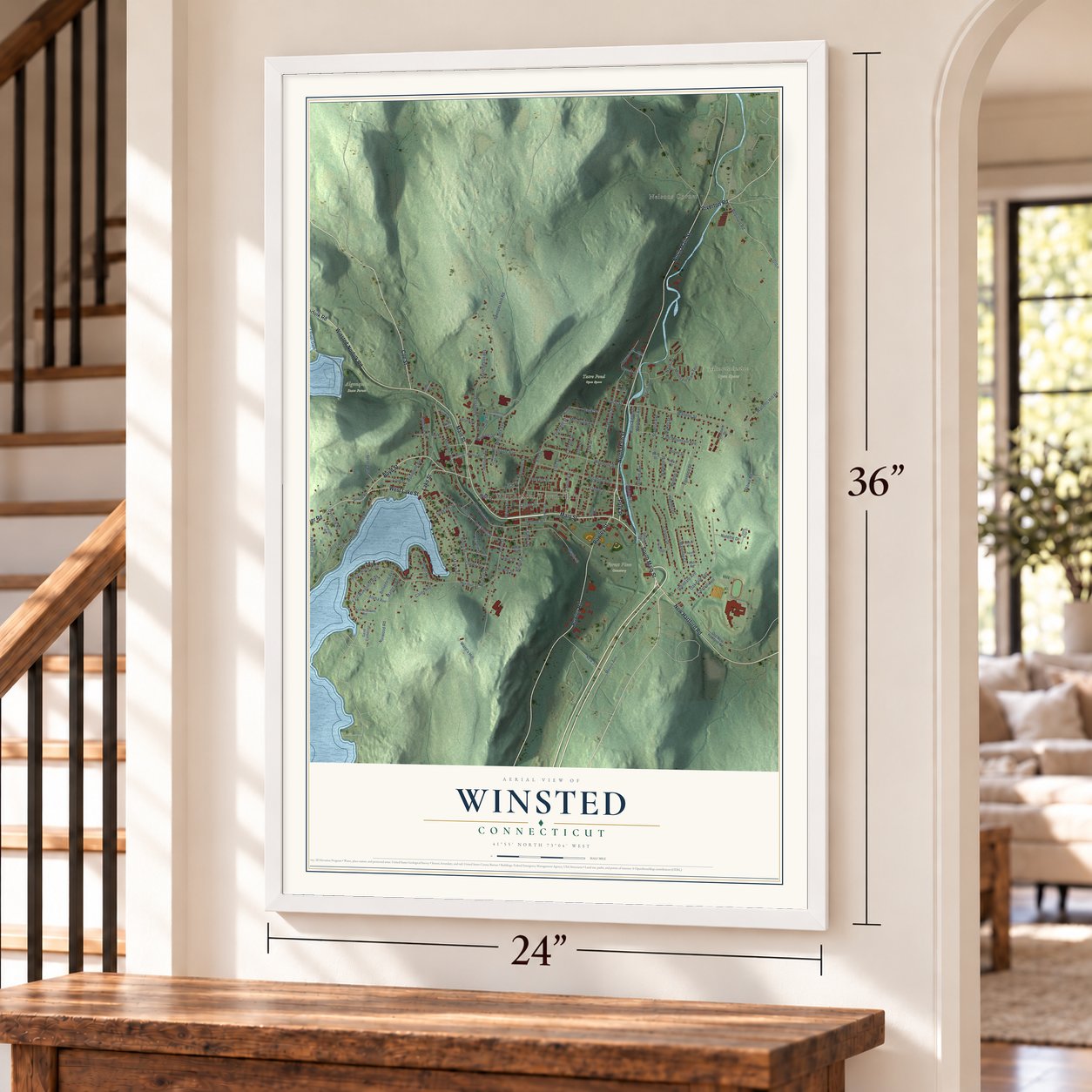 Winsted, Connecticut map, 24 x 36 inch print in a white frame by a staircase