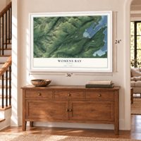 Womens Bay, Alaska map, 24 x 36 inch print in a white frame above a dresser by a staircase