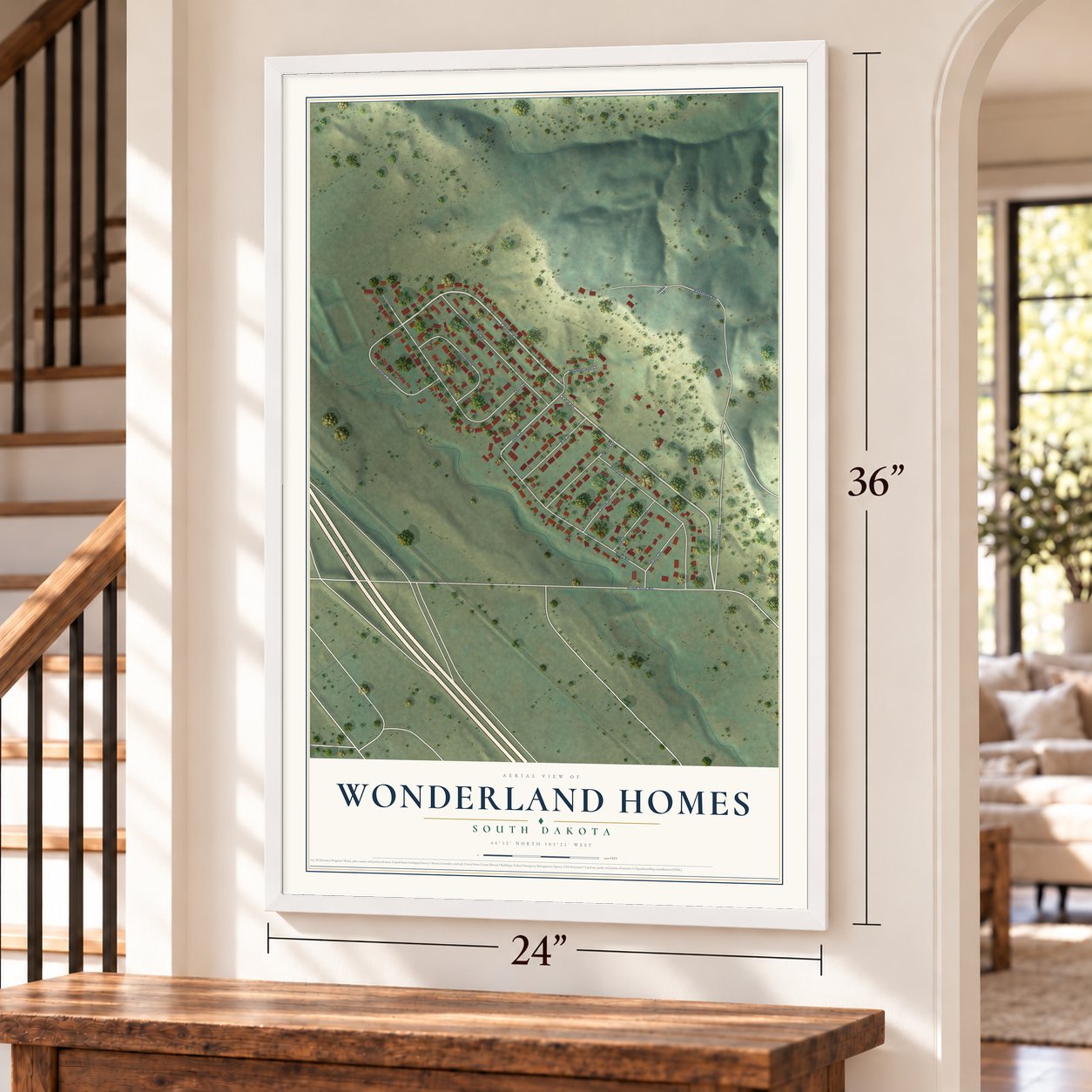 Wonderland Homes, South Dakota map, 24 x 36 inch print in a white frame by a staircase